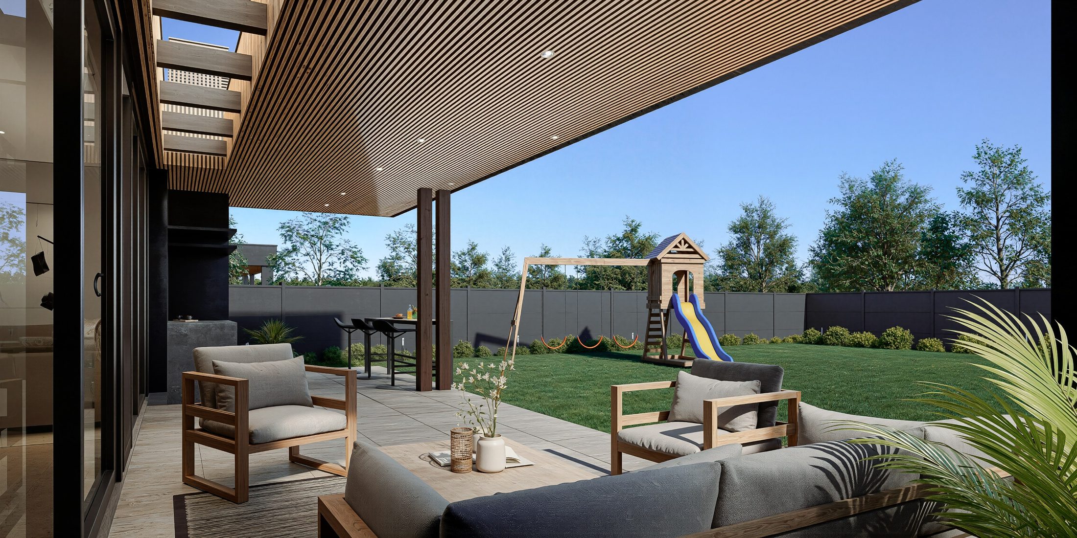 Terraza techada con quincho, living exterior y juegos infantiles en el patio trasero.